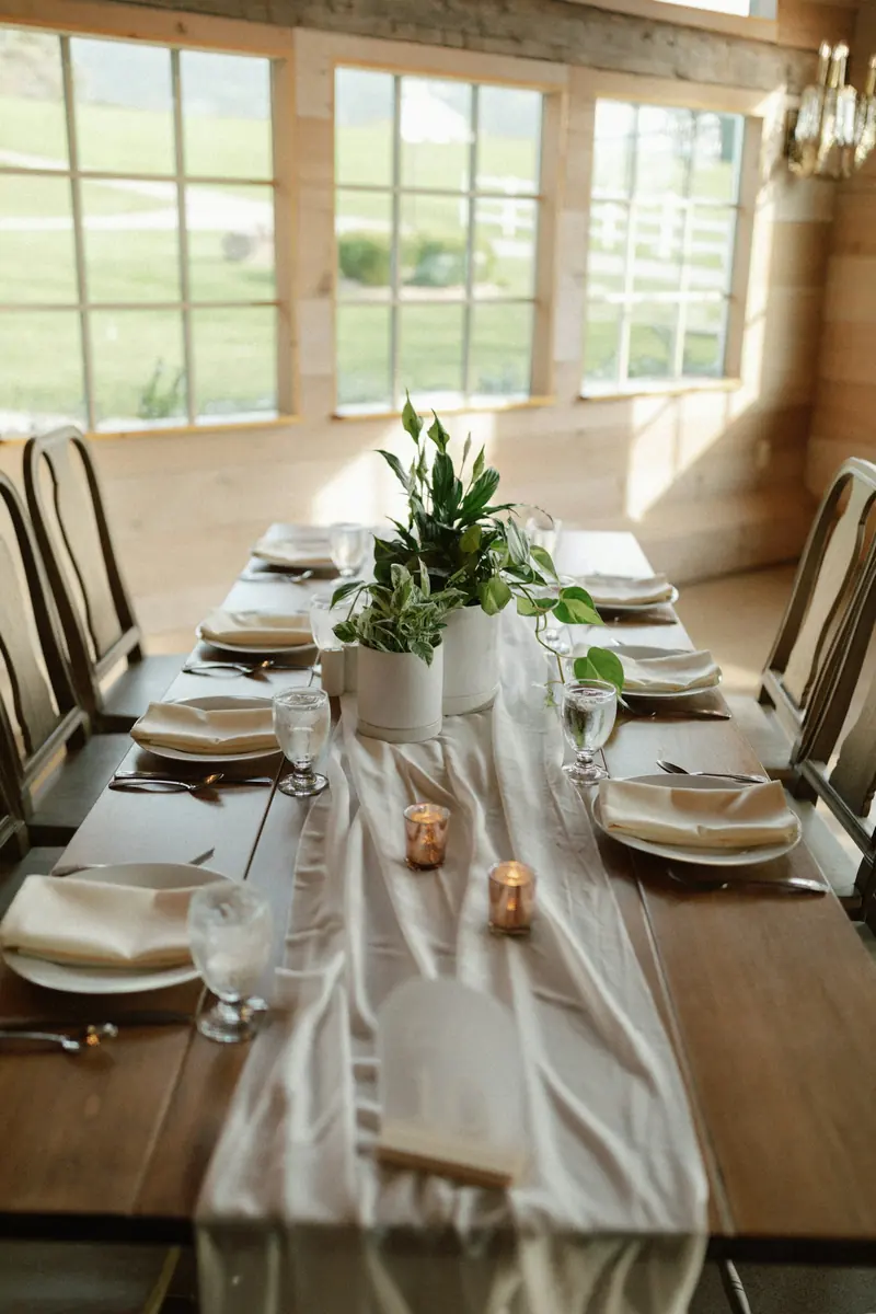 Place settings down a long wooden table