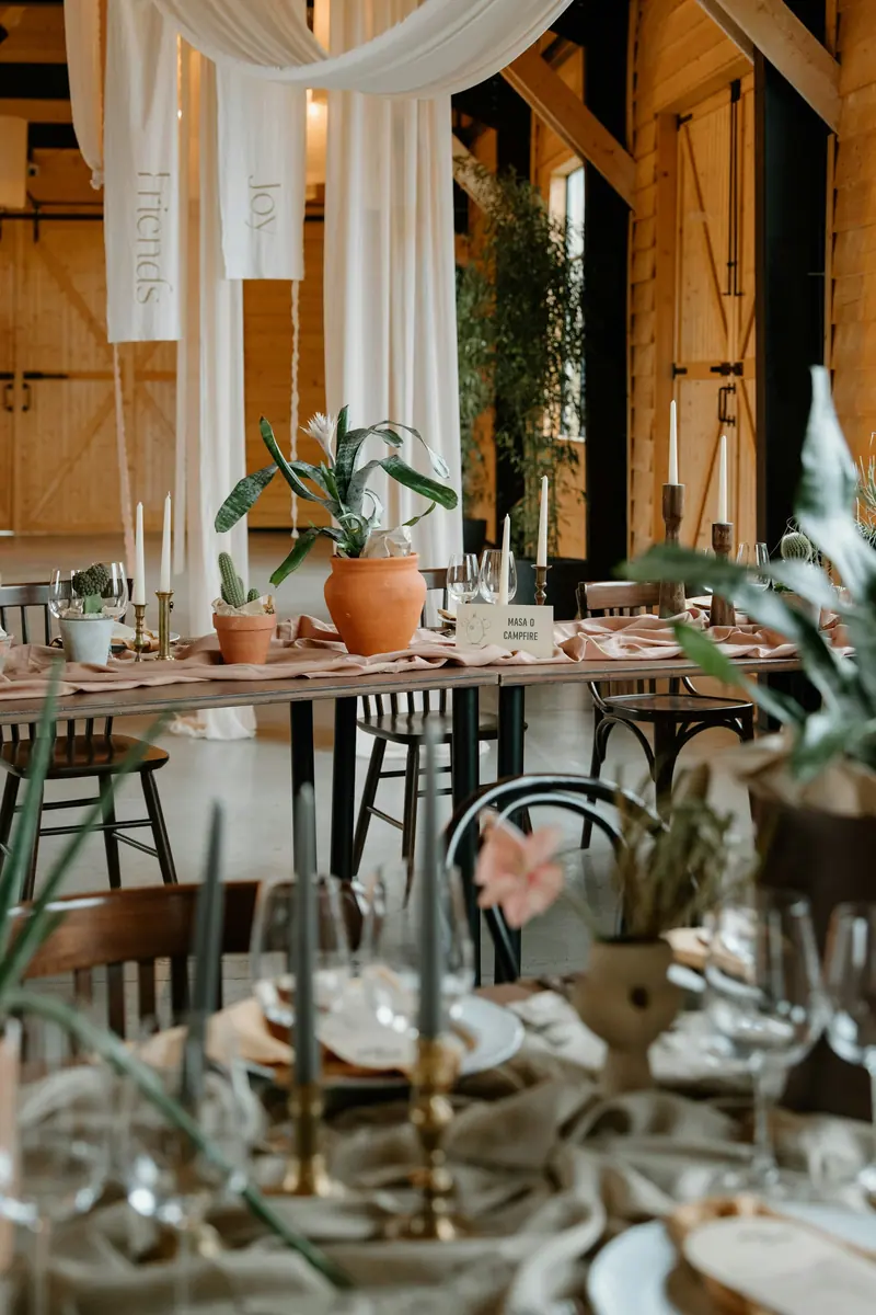 Candles and greenery on a set table