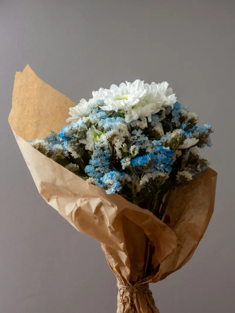 A garden bouquet wrapped in brown paper