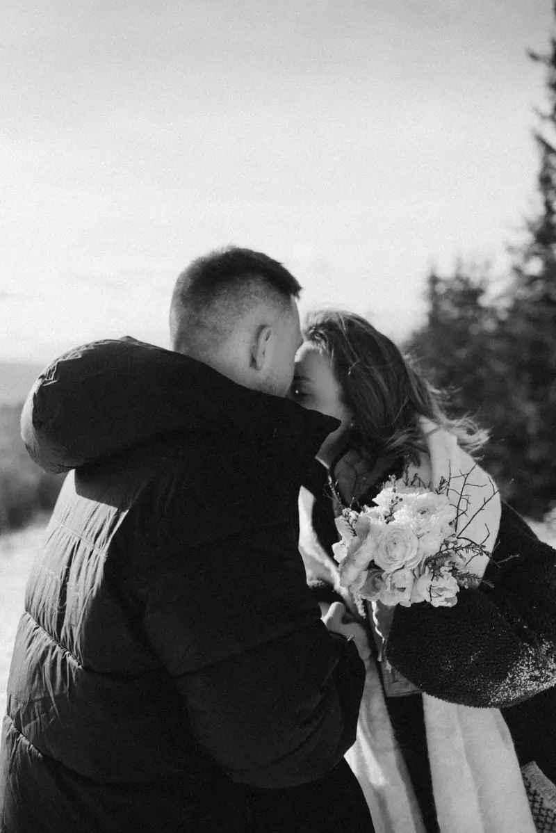 A couple kissing in the snow