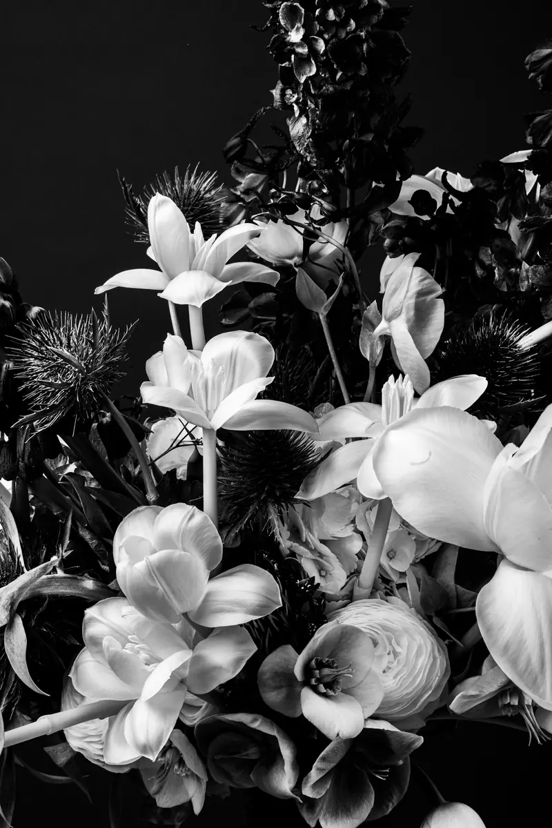 A loose bouquet of lilies and roses
