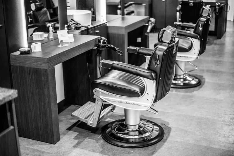 Barber chairs lined up in a quiet shop