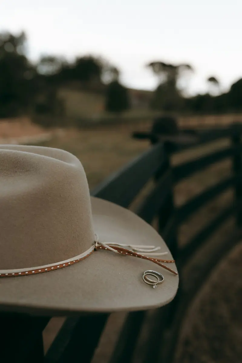 A cowboy hat with two rings on its band