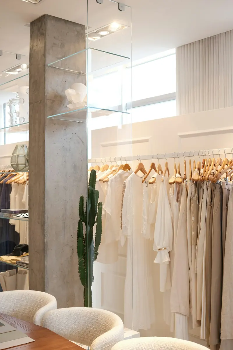 A rack of neutral dresses