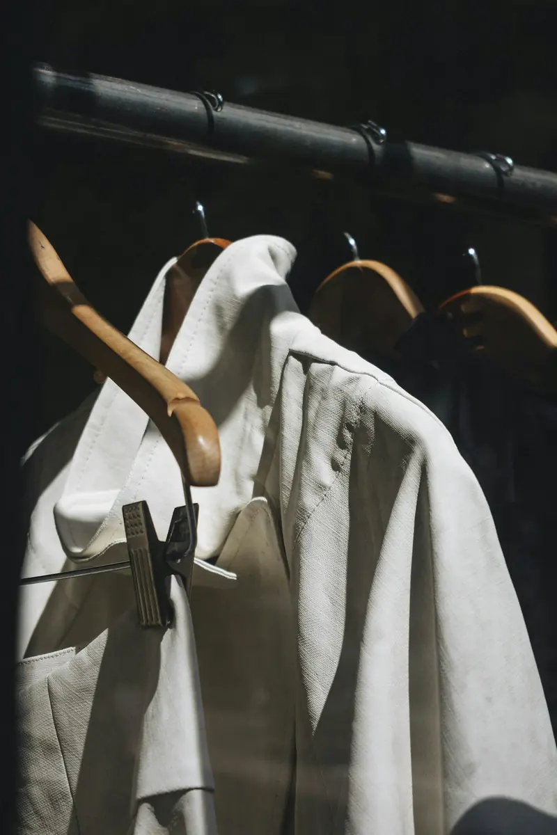 A white shirt on a wood hanger