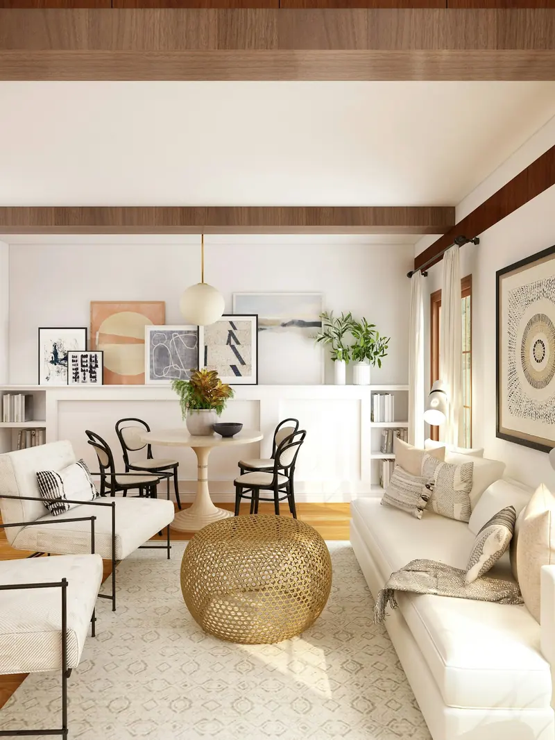 A cream living room with a round brass table