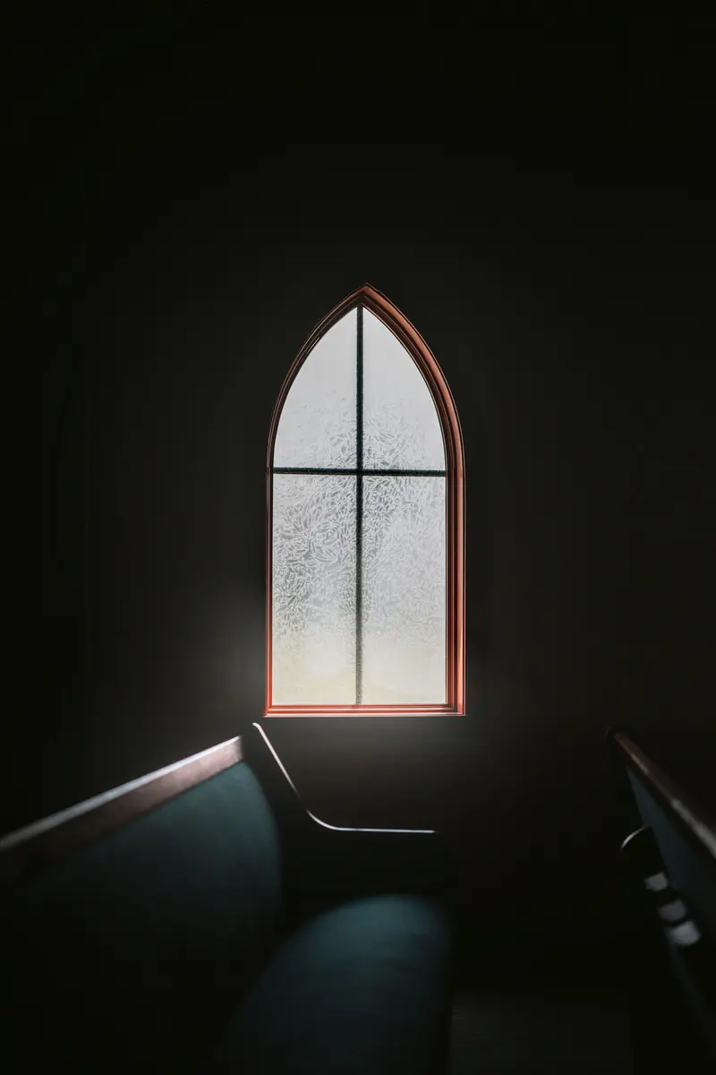 Light coming through an arched church window