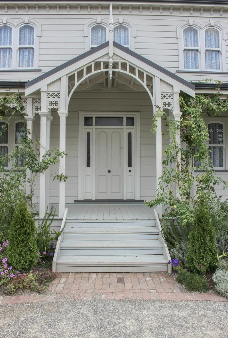 White front steps leading up to a white door