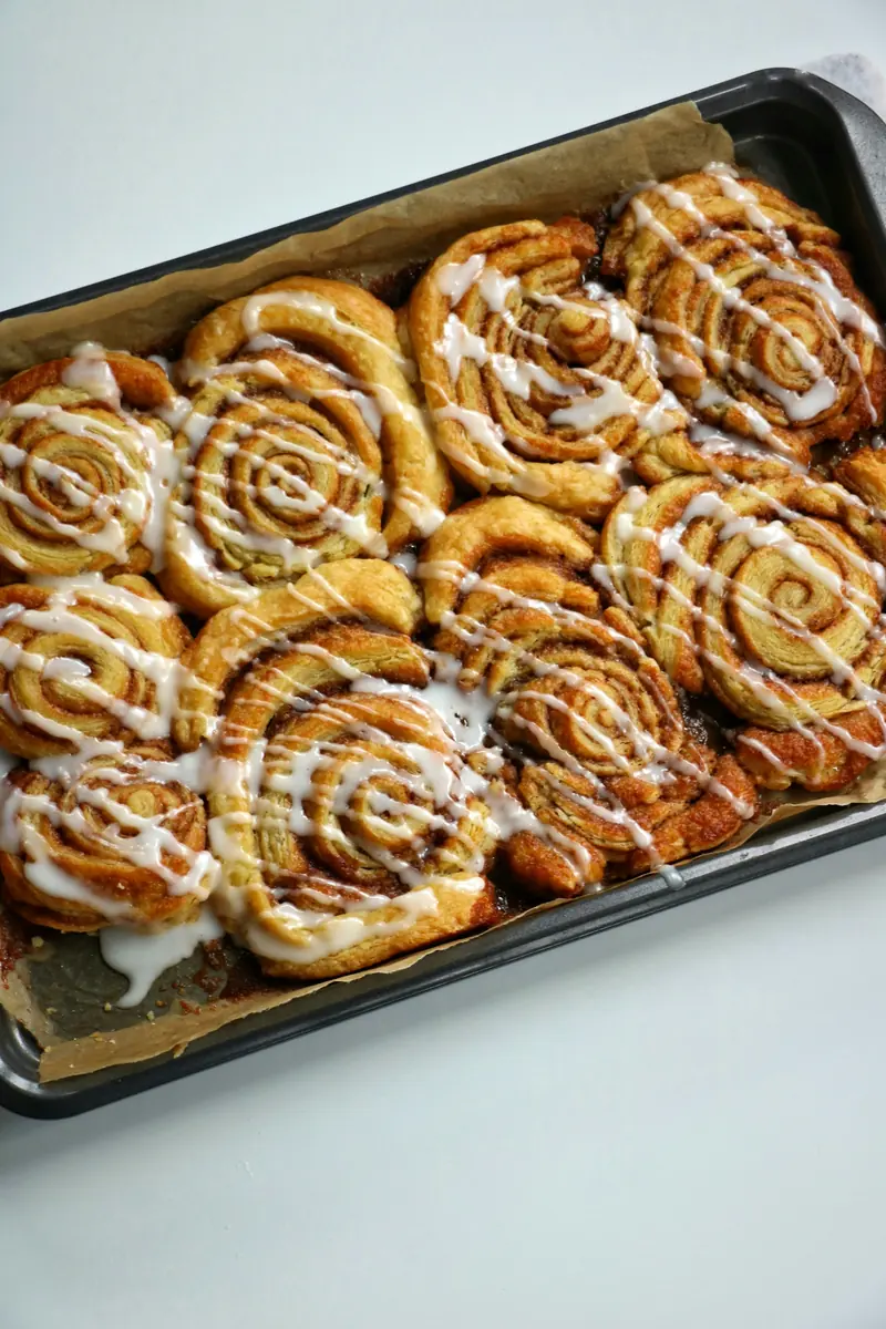 A pan of iced cinnamon rolls